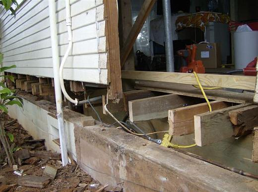 Rotted lower wall opened for structural repair